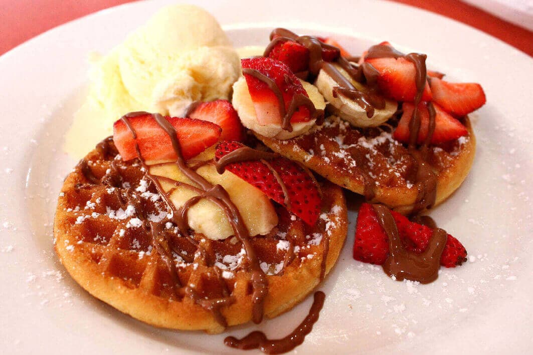 Delicious Hot Belgian Waffles With Strawberries and Ice Cream