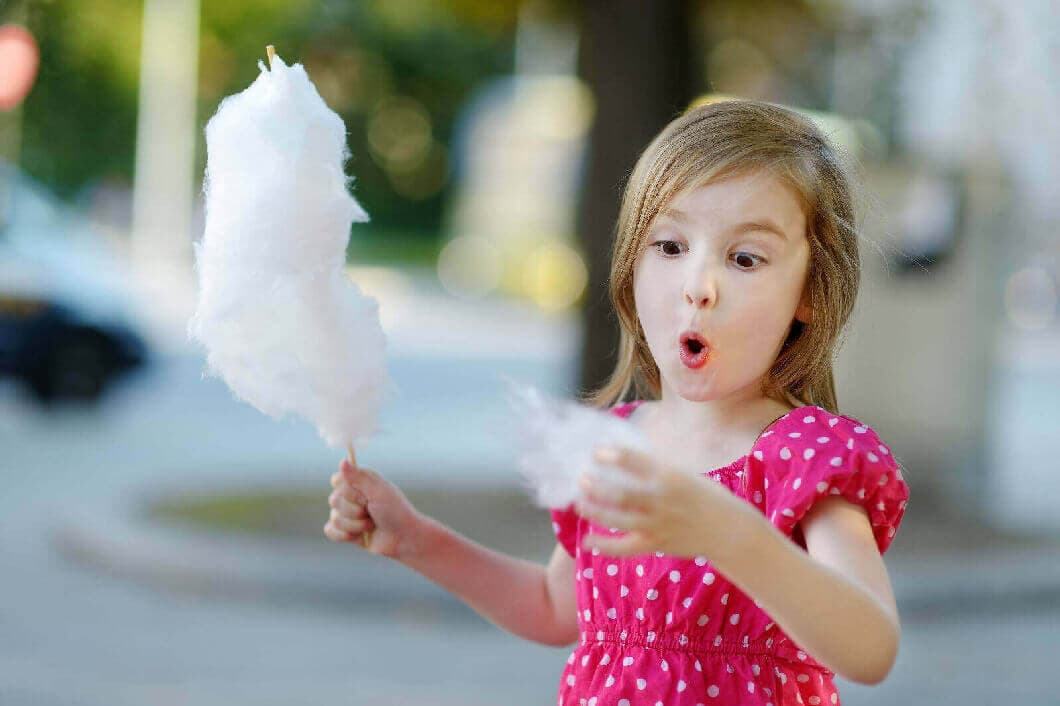 Young Girl Eating CandyFloss