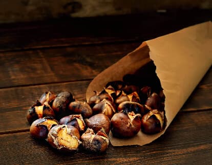 Hot Roasted Chestnuts Spilling Out Of A Bag