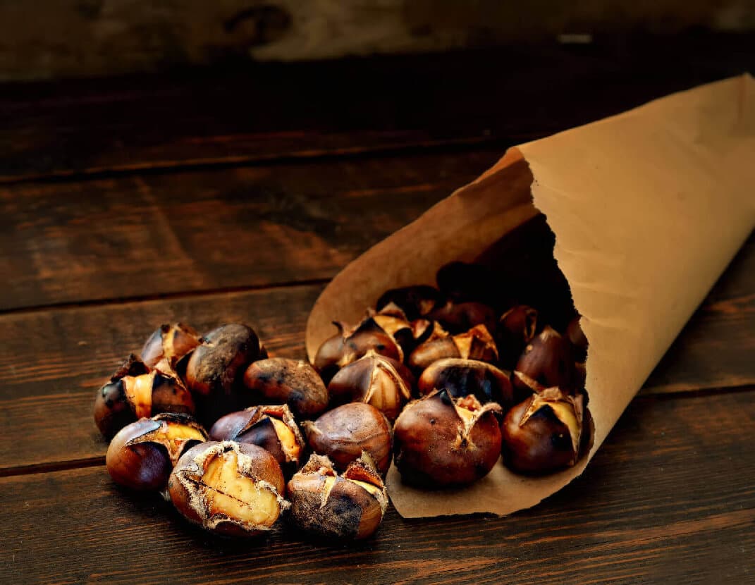 Hot Roast Chestnuts Spilling Out Of A Bag
